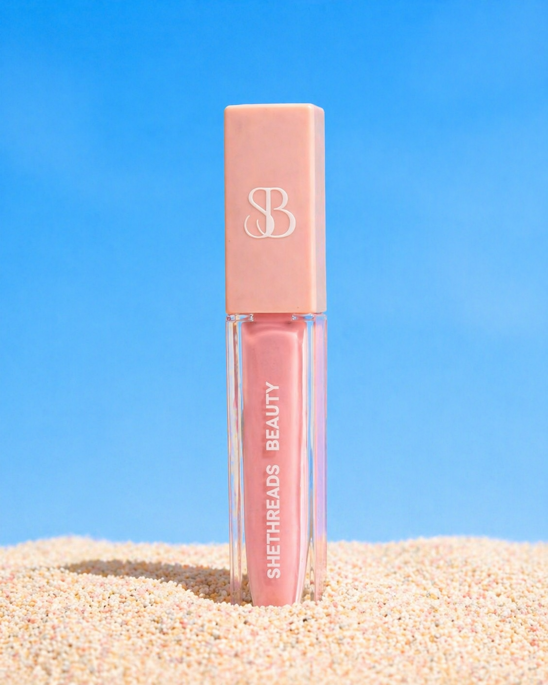 Shethreads Legacy lip gloss on sand